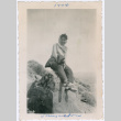 Woman sitting on rock (ddr-densho-363-15)