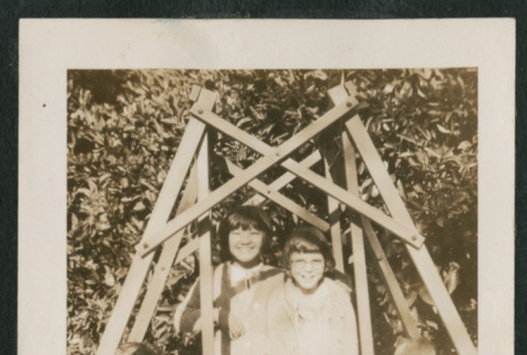 4 kids on a wooden swing (ddr-densho-378-367)