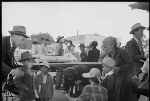 Japanese American family with baggage (ddr-densho-151-289)