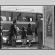 Japanese American family boarding bus (ddr-densho-151-145)