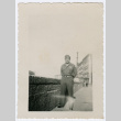 Soldier standing on city sidewalk (ddr-densho-368-77)