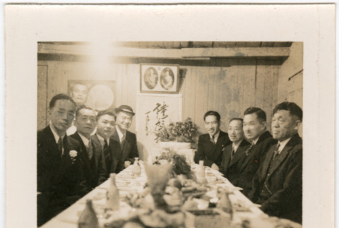 Group of men around banquet table (ddr-densho-426-1436)