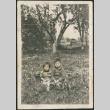 Two children sitting in garden (ddr-densho-293-48)
