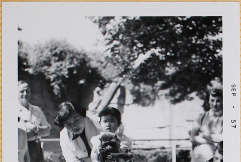 Yoshiko and Leslie Shiomi with monkey in dress (ddr-densho-522-411)