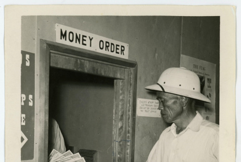 Eikichi Toshima purchasing war bonds (ddr-densho-37-2161)