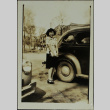 A woman standing next to a car (ddr-densho-328-542)