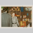 Man and woman by product display (ddr-densho-426-1095)