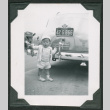 Small child standing next to car (ddr-densho-475-725)