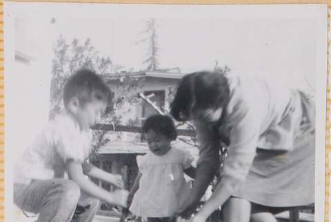 Yoshiko Shiomi with Susan and William Shiomi with puppy (ddr-densho-522-219)
