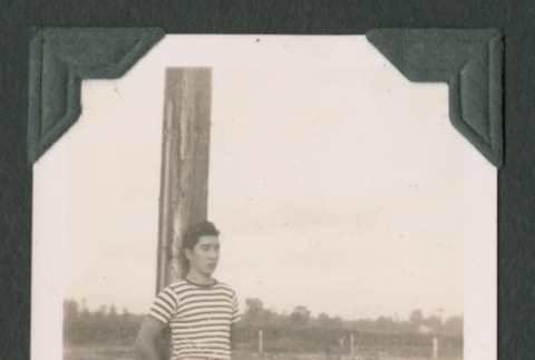 Man leaning on post (ddr-densho-471-99)
