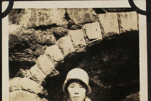 Woman sitting in boat under stone bridge (ddr-densho-423-500)