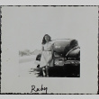 A woman leaning against a car (ddr-densho-321-1189)