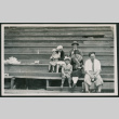 Family photo on bleachers (ddr-densho-378-723)