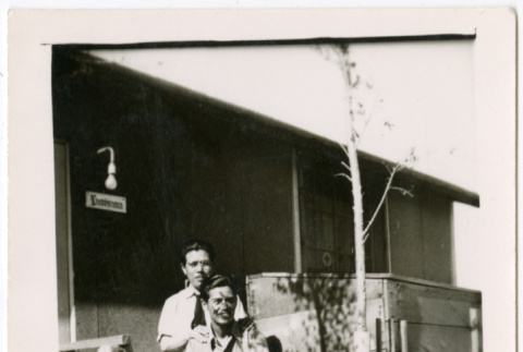 Two men outside barracks (ddr-densho-329-1331)