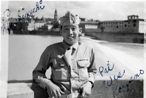 Man in uniform standing on bridge (ddr-densho-474-233)