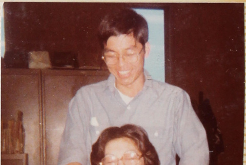 Man behind woman in office (ddr-densho-426-1247)