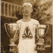 Man holding trophies (ddr-njpa-4-2327)