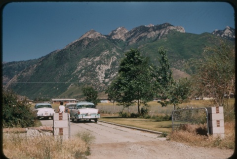 Cars with mountains in the background (ddr-densho-338-481)