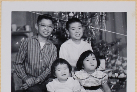 Leslie, Susan and William Shiomi with unidentified boy (ddr-densho-522-534)