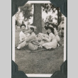 Three women and man in uniform having a picnic (ddr-ajah-2-524)