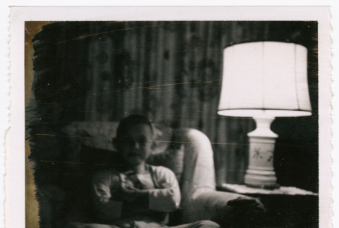 Peter seated in arm chair (ddr-densho-462-100)