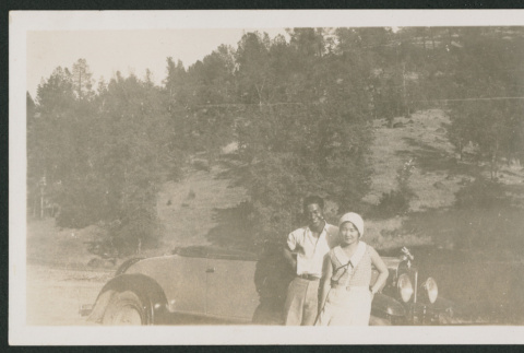 couple in front of car (ddr-densho-378-892)