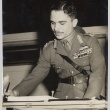 A man in military dress signing a Document (ddr-njpa-1-646)