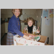 Two women in Christmas decorations (ddr-densho-534-63)