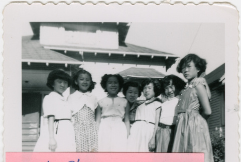 Group of 7 girls outside house (ddr-densho-430-297)