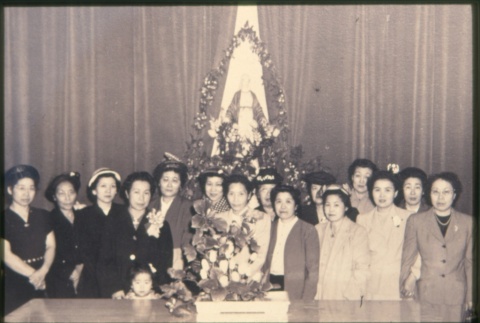 Women standing behind table. (ddr-densho-330-35)
