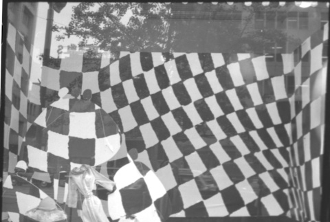 Large window display with checkered background (ddr-densho-426-2294)