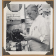 Pharmacy worker at The Owl Drug Co. (ddr-densho-542-100)