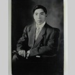 Portrait of man, seated, holding gloves (ddr-densho-252-117)