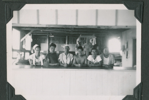 Six men sitting at a counter (ddr-densho-471-85)
