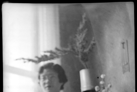 Tomoye (Nozawa) Takahashi posing by large vase (ddr-densho-426-2016)