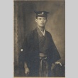 Man wearing Japanese clothes and cap (ddr-njpa-2-618)