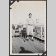 Photo of young man in baseball uniform on ship (ddr-densho-326-93)