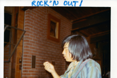 Fred Yamamoto playing the guitar (ddr-densho-336-283)