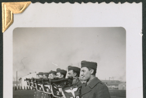 Men in formation with bugles with Battalion 2B Insignia (ddr-densho-434-61)