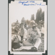 Family seated on blanket in park (ddr-densho-483-583)