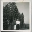 A man standing on a scenic road (ddr-densho-298-265)