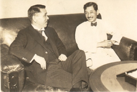 Hiroshi Saito and a man seated on a couch (ddr-njpa-4-2513)