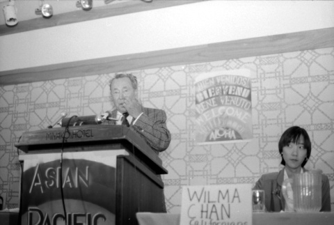 Stanley Diamond speaking, Wilma Chan at table (ddr-densho-1007-534)
