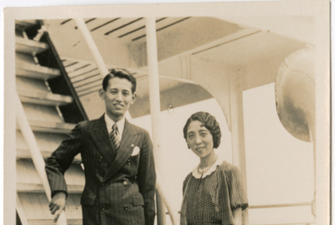 Man and woman on stairway aboard ship (ddr-densho-426-1523)