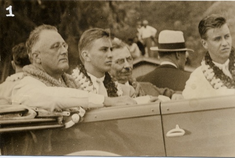 Franklin D. Roosevelt wearing leis in a car (ddr-njpa-1-1612)