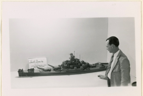 Mr. Hoyt Martin with a ship model (ddr-densho-37-1370)