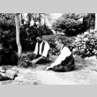 Two men sitting in a garden (ddr-densho-18-20)