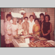 Group of women by table with food (ddr-densho-523-594)