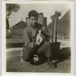 Soldier holding a puppy (ddr-densho-201-76)