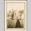 Two men and a woman standing on lawn (ddr-densho-316-264)